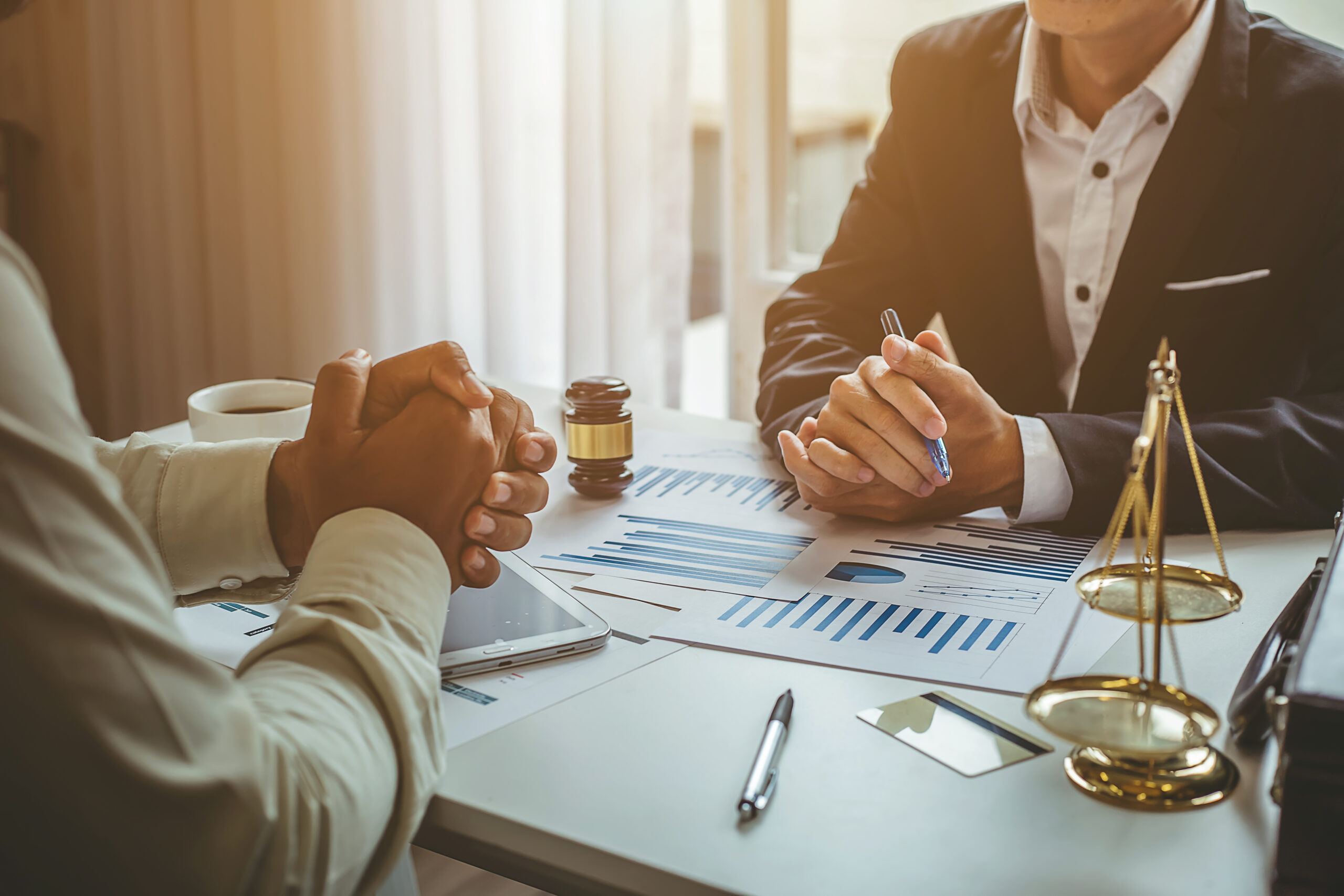 Business lawyer working about legal legislation in courtroom to help their customer